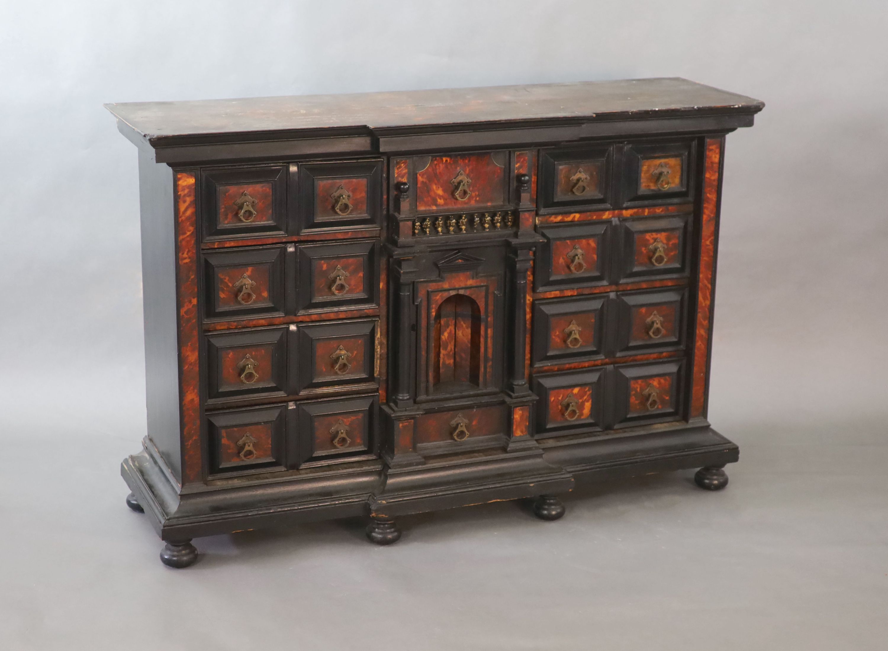 A late 17th century Portuguese ebony and tortoiseshell table cabinet, W.128cm D.39cm H.85cm